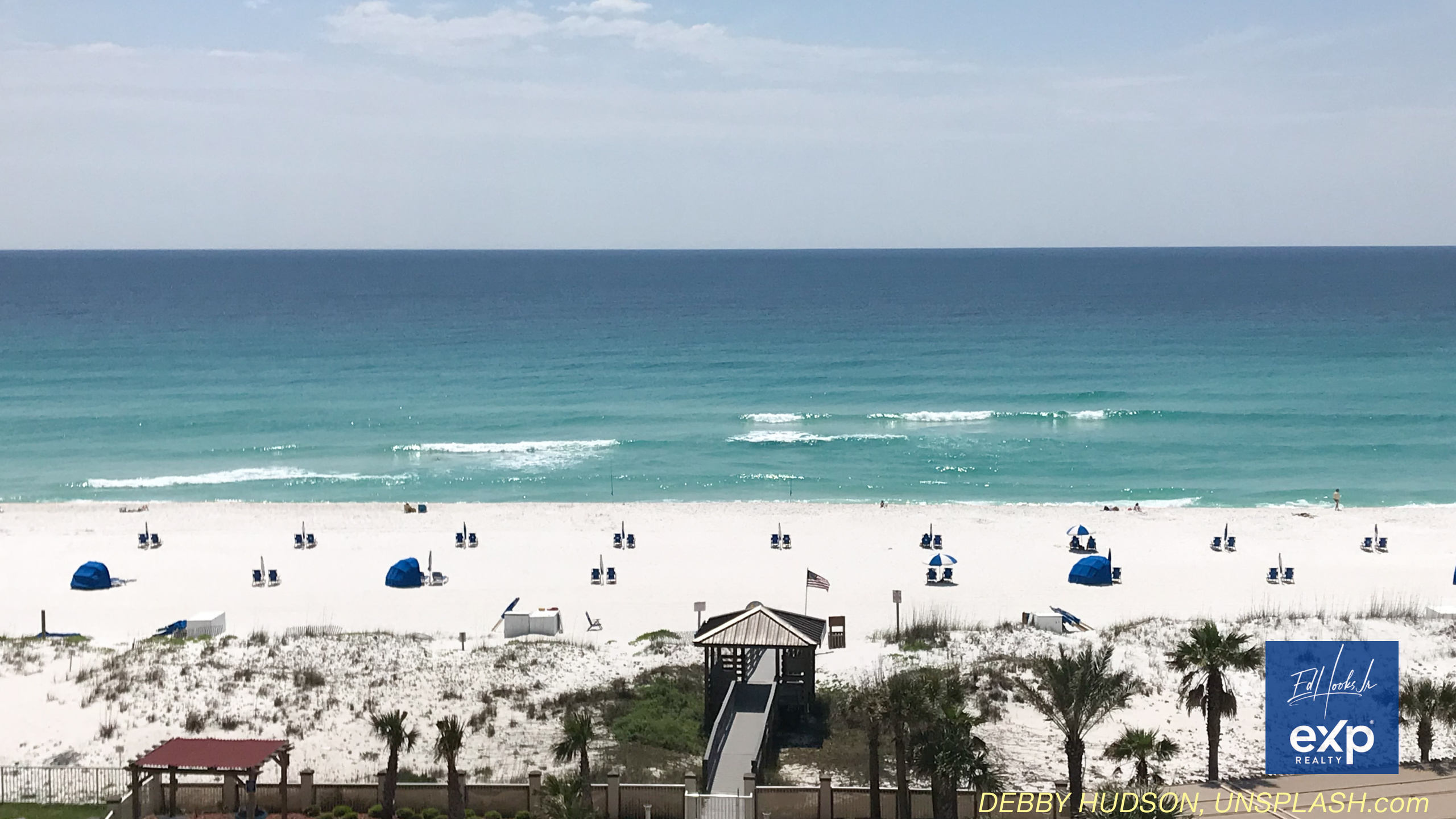 Emerald Coast Beach scene, umbreallas and personal shelters arrayed